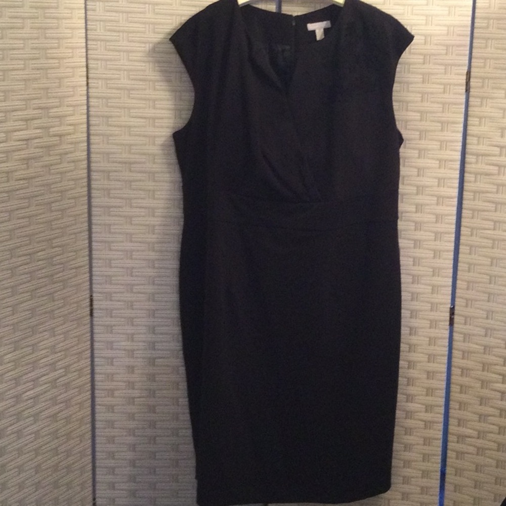 Black dress with fabric flower detail.